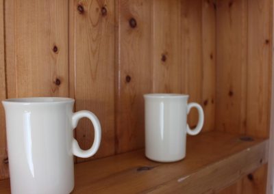 coffee mugs on shelf